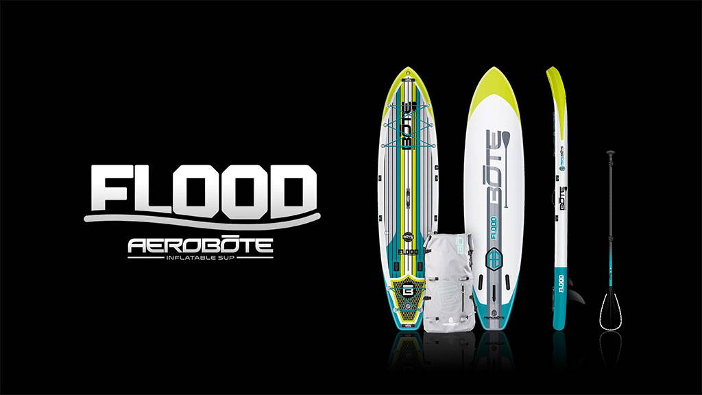 Flood Aero inflatable paddle board kit displayed with board, paddle, pump, and carry bag on a black background.