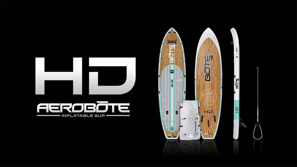 HD Aero inflatable paddle board kit displayed with board, paddle, pump, and carry bag on a black background.