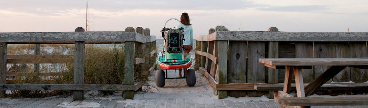 A person using BOTE Accessories on boardwalk