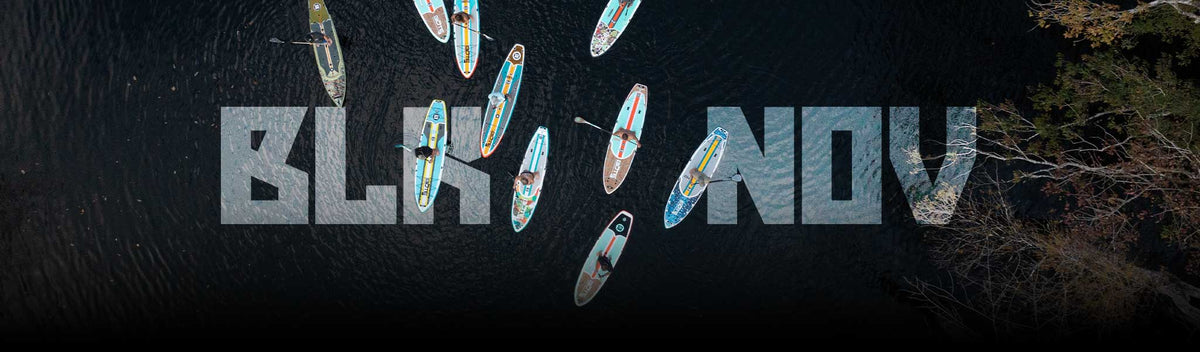 Aerial view of paddle boarders on dark water with large text overlay reading “BLK NOV.”