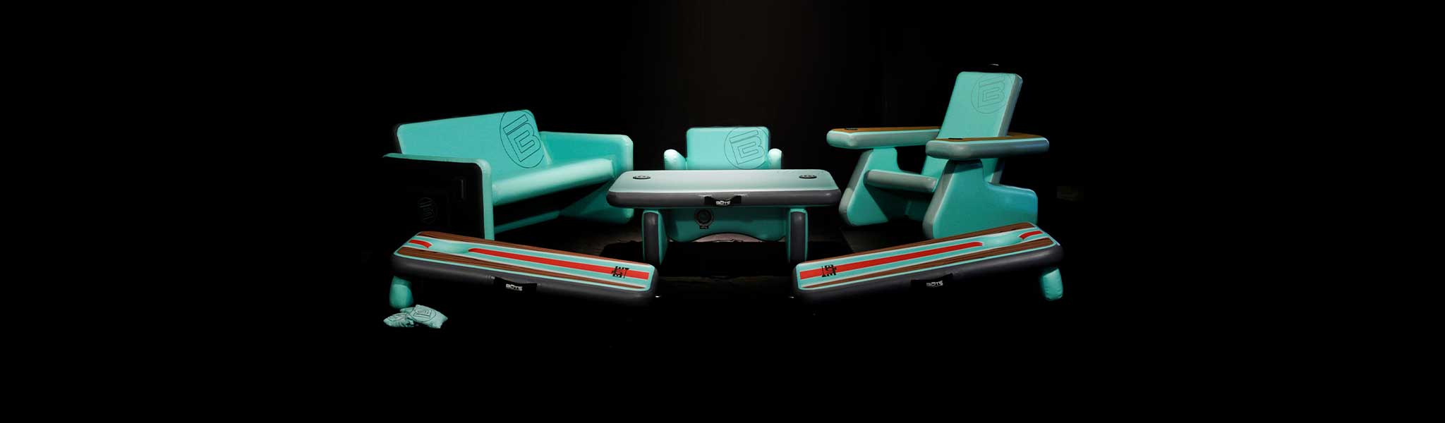 Inflatable Aero Lounge Set displayed against black background with chairs and table.