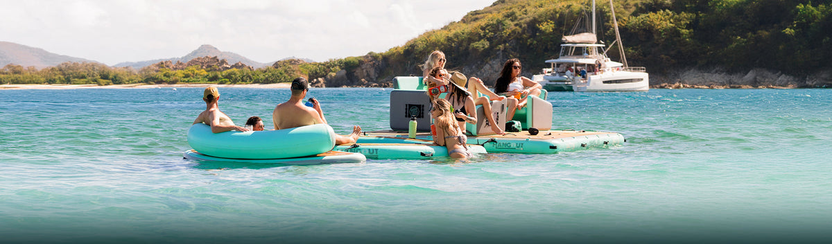 Children playing on an inflatable raft in shallow water