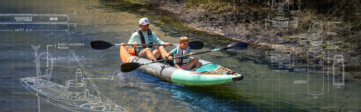 A father and his kid sitting in a kayak on the water