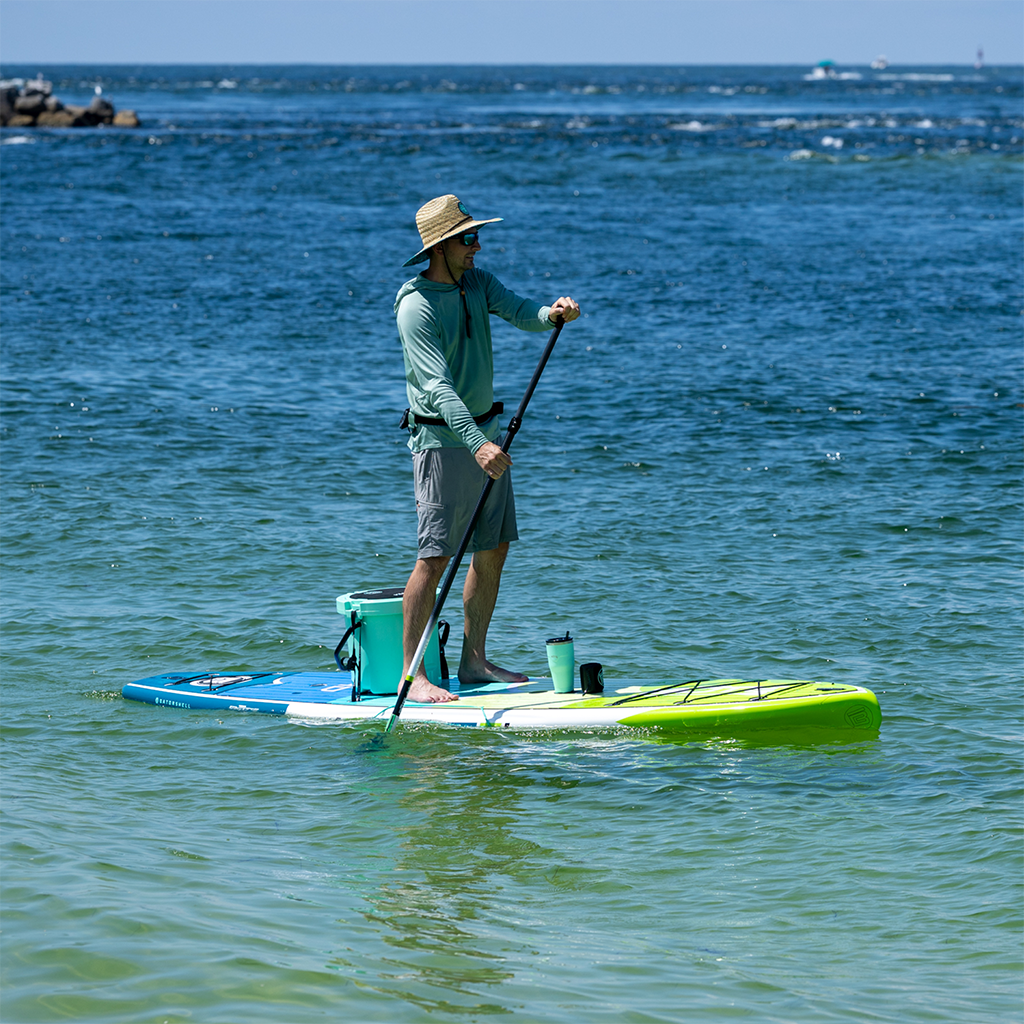 Man paddleboarding on HD Gatorshell with cooler seat and magnetic cup holder.