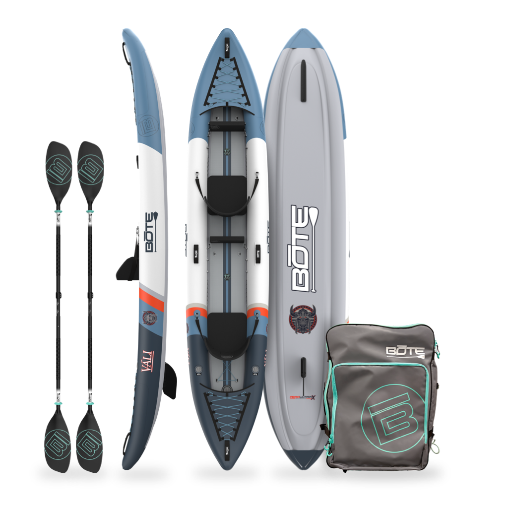 Inflatable kayak with paddles and a carrying bag on a white background