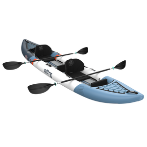 Blue and white kayak with two paddles on a white background