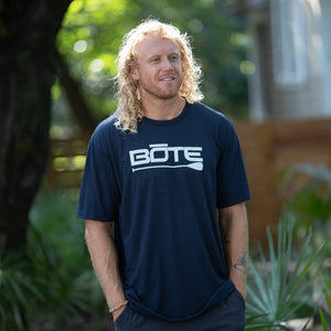 Image of man wearing Men's Logo Navy Tee Shirt