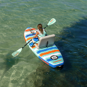 Aerial view of child seated kayaking on a Kids FlowRider Aero in clear water.