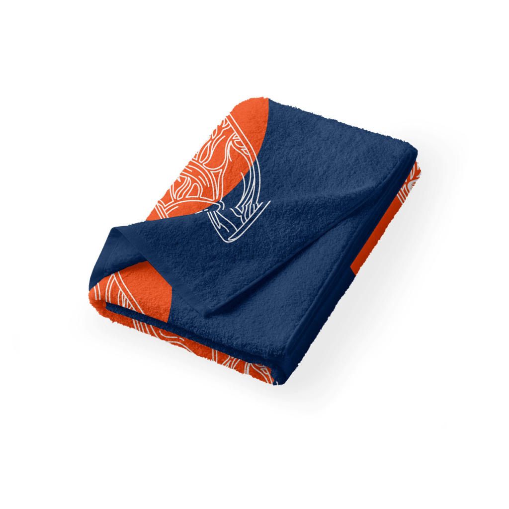 Folded BOTE Fin Woven Towel with plush navy fabric and orange patterned lining visible at the edges.