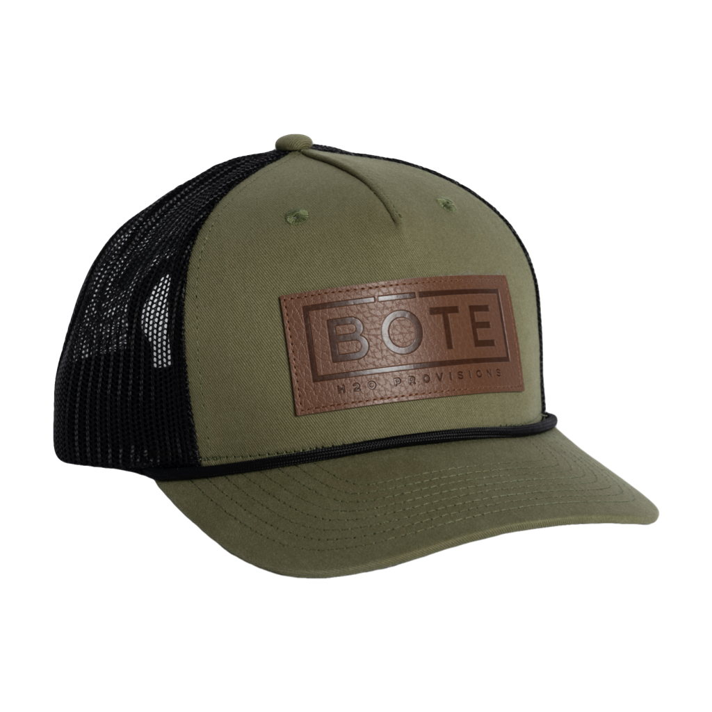 Front view of the BOTE Boxed Logo Hat with brown Patch in dark green.