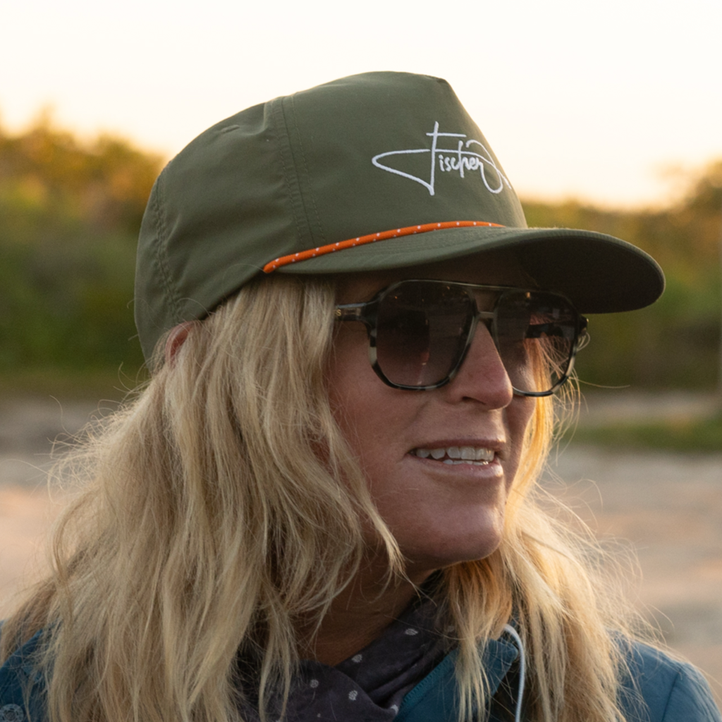 A person wearing a BOTE Fischer Snapback Hat
