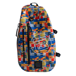 Highwater Slingpack in colorful geometric pattern with front zipper pocket and large circular logo.