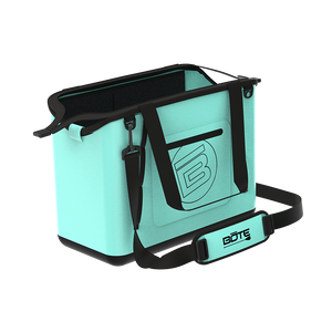 Angled front view of Mule Tote in mint with black handles, strap, and exterior pocket.