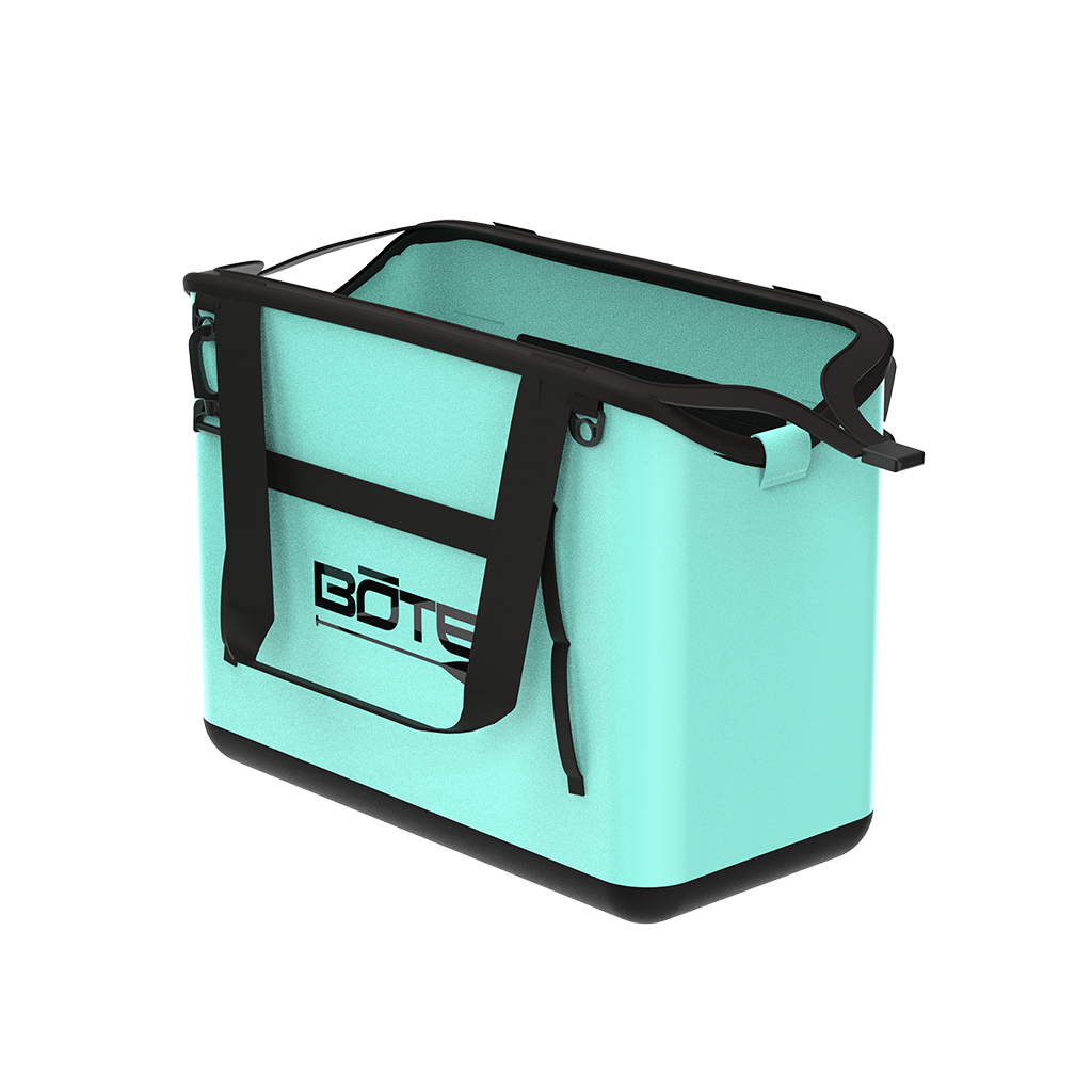 Rear angled view of Mule Tote in mint with black handles and logo on back panel.