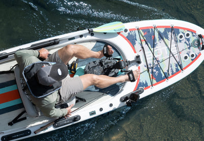Top view of ProRider Aero with pedal drive and paddle on clear water.