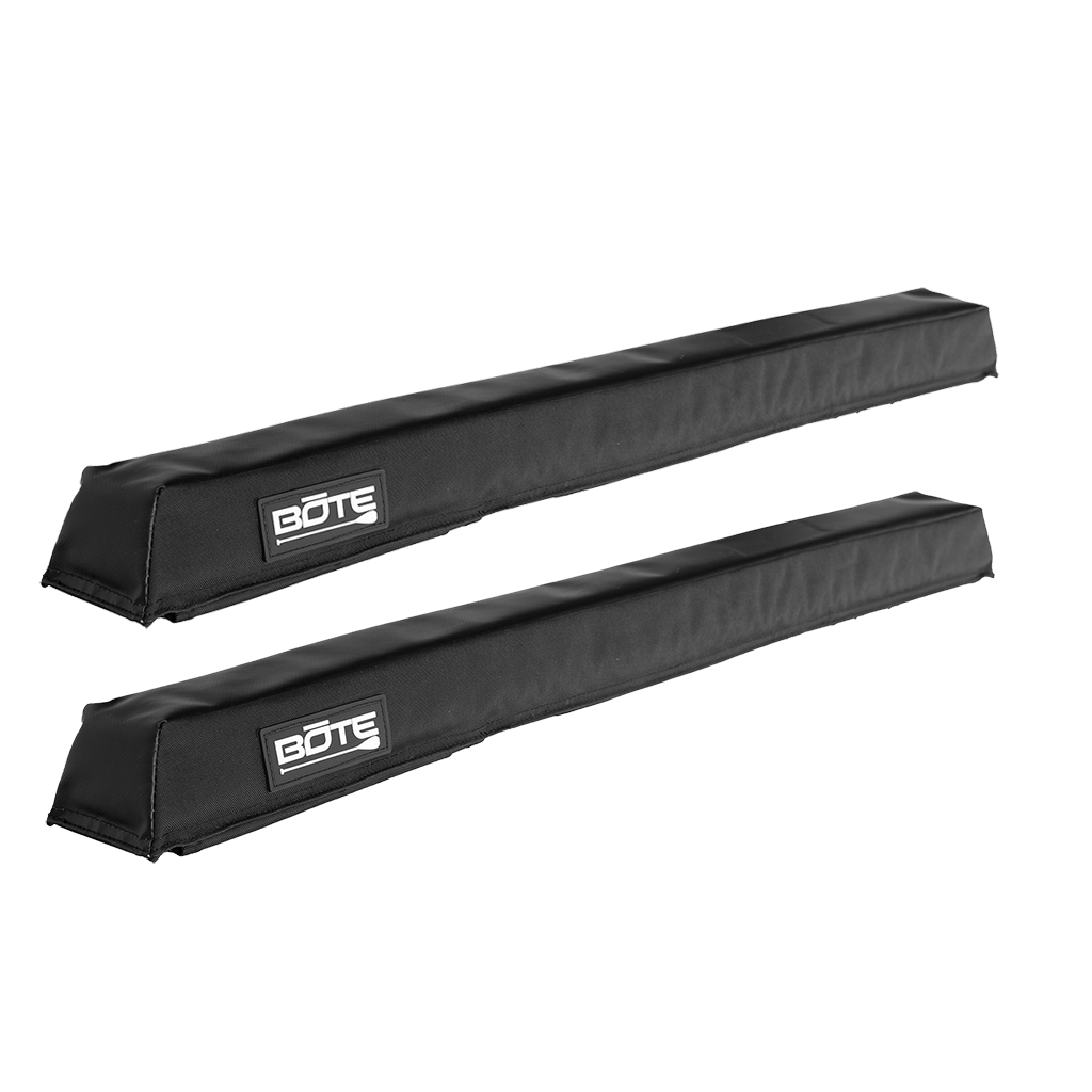 Angled view of a pair of black padded Roof Rack Pads with BOTE logo patches.
