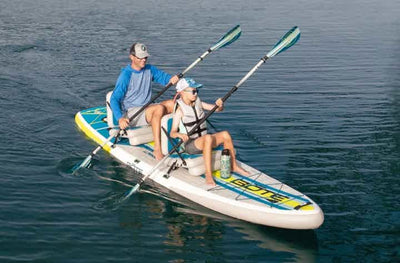 Two people paddling the LowRider Aero Tandem together on a lake.