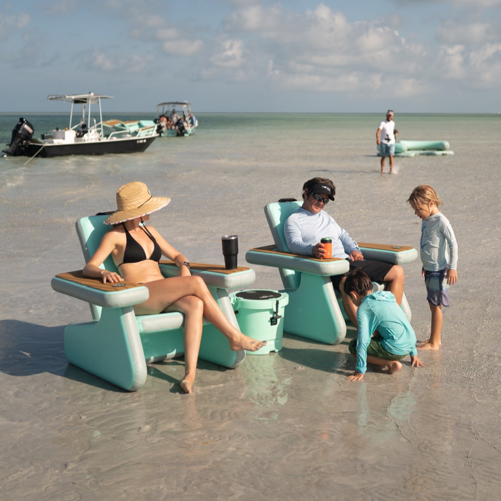Lifestyle picture of a family sitting in Inflatable AeroRondak® Chairs