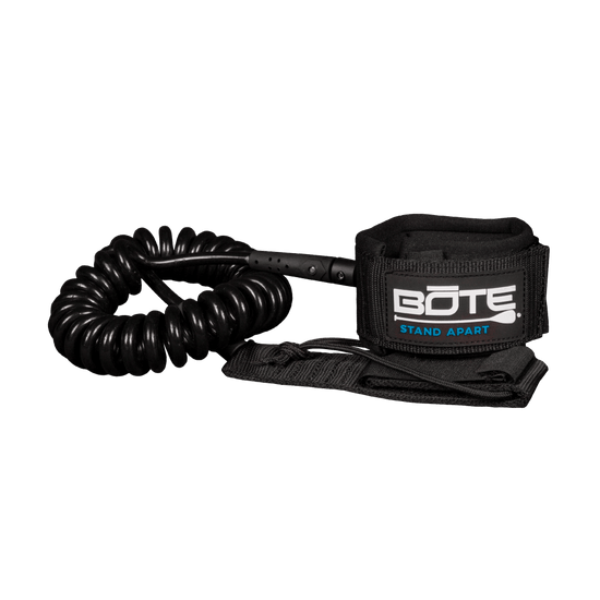 Black coiled leash with BOTE Stand Apart logo on the velcro ankle strap